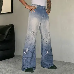 Men’s washed light blue slight flare jeans with distressed knees; black denim body with rhinestone accents; curved leg with rhinestone appliqué; vintage street style long pants—fashionable, versatile slim fit that flatters the figure; a cool, unique trend