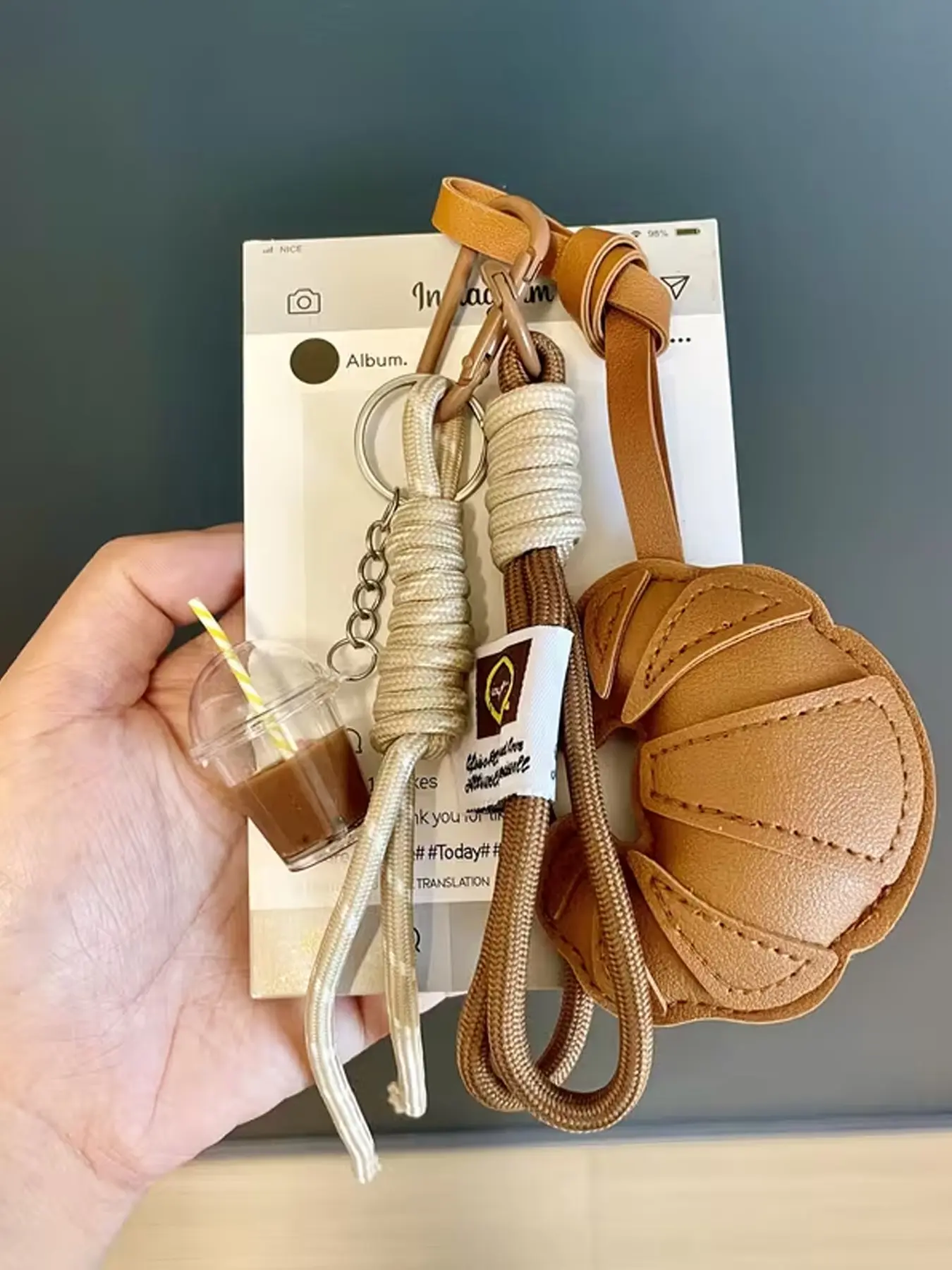 Caramel-Brown-Croissant-Milk-Tea-Cup-Charm, Vintage-Leather-With-Woven-Style, Dual-Function-Keychain-With-Hanging-Strap, Suitable-For-Everyday-Backpacks-And-Commuters’-Keys, Keychain Bag Pendant, Keyrings