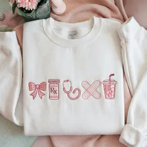 [MADE IN US] Embroidered Nurse Icon Sweatshirt, Healthcare Shirt, CNA Sweatshirt, Medical Assistant, Nursing Grad Gift, Coquette Nursing Sweatshirt"