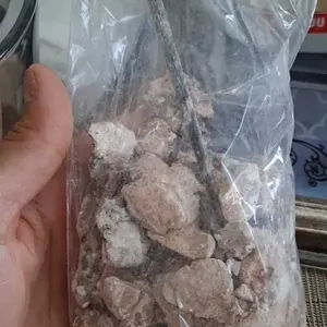 Paquita la del barro- broken ellottee- white and brown clays and kaolins in a shape of long figure. Wrapped in plastic bag/ made in Mexico