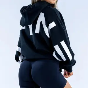 Signature Oversized Hoodie for Women Unisex Boxy Fit with Front Pocket Drawstring Hood and Ribbed Cuff True to Size 65% Cotton 35% Polyester