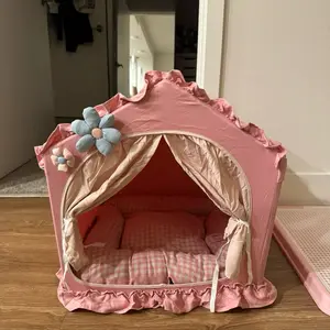 An Indoor Dog House with Pink Floral Design and Soft Cushions for Pet Comfort