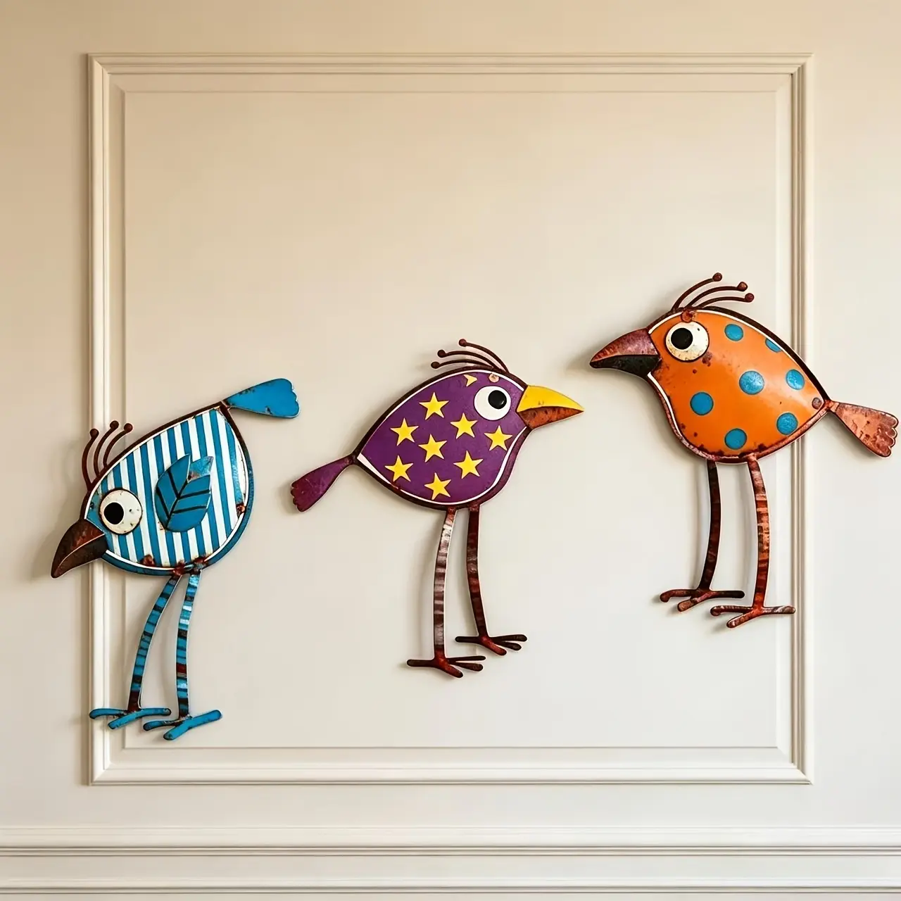 Set of 3 vintage distressed iron art bird wall decorations—each with unique color combinations (blue stripes, purple base with yellow stars, orange base with polka dots). Playful hand-painted finish with a vintage distressed iron texture. Metal constructi