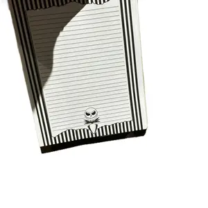 Black and White Notepad with Striped Design and Jack Skellington Illustration