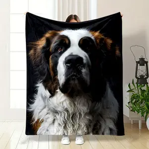 This is a blanket printed with a Saint Bernard dog. The dog has a gentle and loyal expression, with its distinctive white, brown and black fur vividly presented. The blanket is made of soft pl