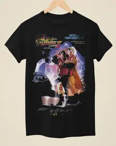 [SALE UP TO 30%] Back To The Future Part II Movie Poster Inspired Unisex Black T-Shirt | Retro 80s Sci-Fi Fan Tee | Vintage Film Graphic Shirt Unisex Shirt Made Using 100% US Cotton, Design & Printed In The USA.