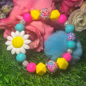 Candy and daisy’s wristlet keychain color scheme turquoise, hot pink, yellow and bling beads made with wire