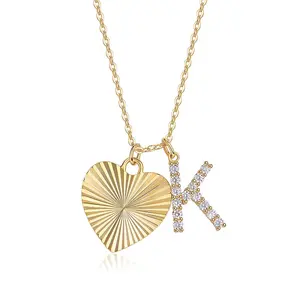 A minimalist, elegant heart-shaped gift for couples—perfect for dates and hypoallergenic. Crafted from gold-plated 925 silver, it features a four-prong setting with a moissanite-encrusted letter "K" and is designed to never fade.