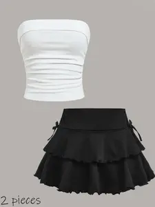 A 2-piece set of casual Strapless camisole tops and half-length skirts for teenagers, featuring simple designs that are versatile, comfortable for sports, and suitable for travel, outings, and gatherings. Teen clothing.