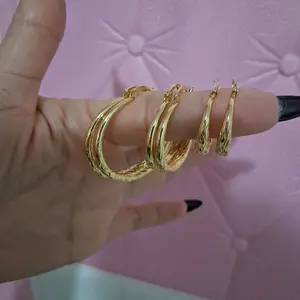 Set  of 3 pairs of 14 k gold laminated Hoop Earrings.