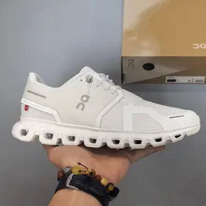 Retro running sneakers with flexible segmented shock-absorbing athletic silhouette, premium breathable knit mesh finished in crisp off-white paired with matching solid trim accents, hollow pure white foam midsole