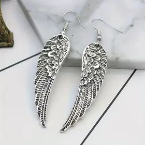 A Set of Unisex Vintage Earrings Featuring Dangling Angel Wings - Trendy Punk Gothic Feather Jewelry Perfect for Parties And Gifts - an Ethereal Touch of Elegance
