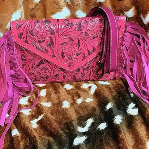 Pink envelope style clutch with fringe
