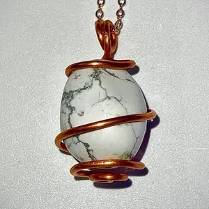 Howlite Crystal Pendant wrapped in pure copper wire, on a rose gold plated copper necklace.