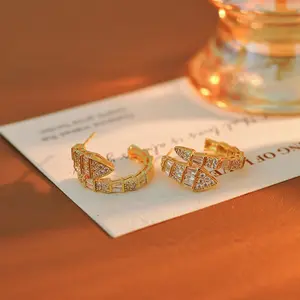 Light luxury full diamond snake earrings women's fashion stud earrings, niche high-end personalized earrings, suitable for high-end banquets