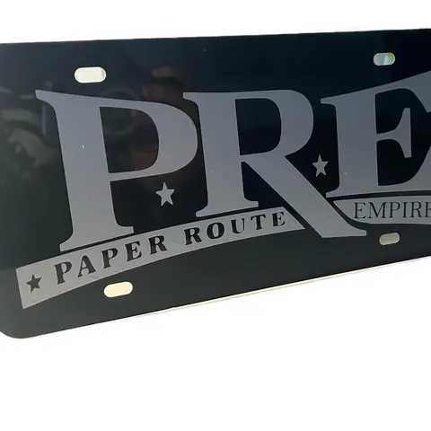 Paper Route Empire P.R.E Front License Plate Holder - Durable Vinyl & Aluminum Car Exterior Accessory, Sleek Black Finish, P.R.E. Fan Badge, Ideal Gift for Vehicle Styling, Car's Exterior Style