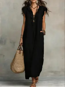 Women’s summer Bohemian maxi dress featuring flutter sleeves and a drapey floor-length silhouette; romantic ambiance complete.