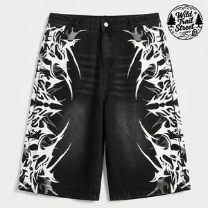 Men’s black washed denim shorts with eye-catching tribal-style pattern decoration, comfortable fit, suitable for everyday wear and street style.