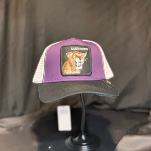 Premium Purple Trucker Cap with Sabertooth Patch - Stylish Outdoor Accessory
