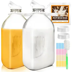 2 Pack 64 Oz Glass Milk Bottles with Nut Milk Bag & 2 Pour Spout & 2 Airtight Lids & Brush- 1/2 Gallon Heavy Duty Jug Pitcher Large Reusable Container for Milk, Juice, Water, Coffee for Refrigerator