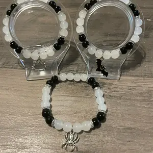 Black and white character designs kitty spider bat bracelets matching