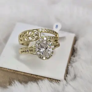 Elegant Gold Tone Engagement Ring with Oval Center Stone and Halo Design for Women's Jewelry