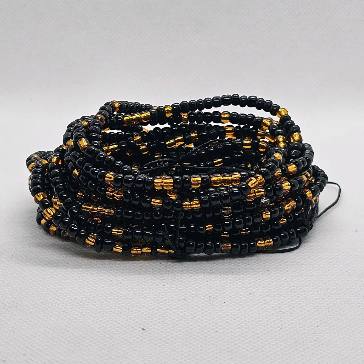 Black and gold waistbeads (tie-on 50 inch) Black and gold waistbeads (tie-on 50 inch)