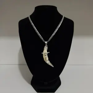 Tooth pendant with Christ on a 4.5mm Cuban chain in 925 silver