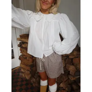 White Long Sleeve Blouse for Women Featuring a Classic Peter Pan Collar Button Down Shirt Perfect for Office Casual and Everyday Wear Lightweight 100 Percent Polyester Long Sleeve Blouses