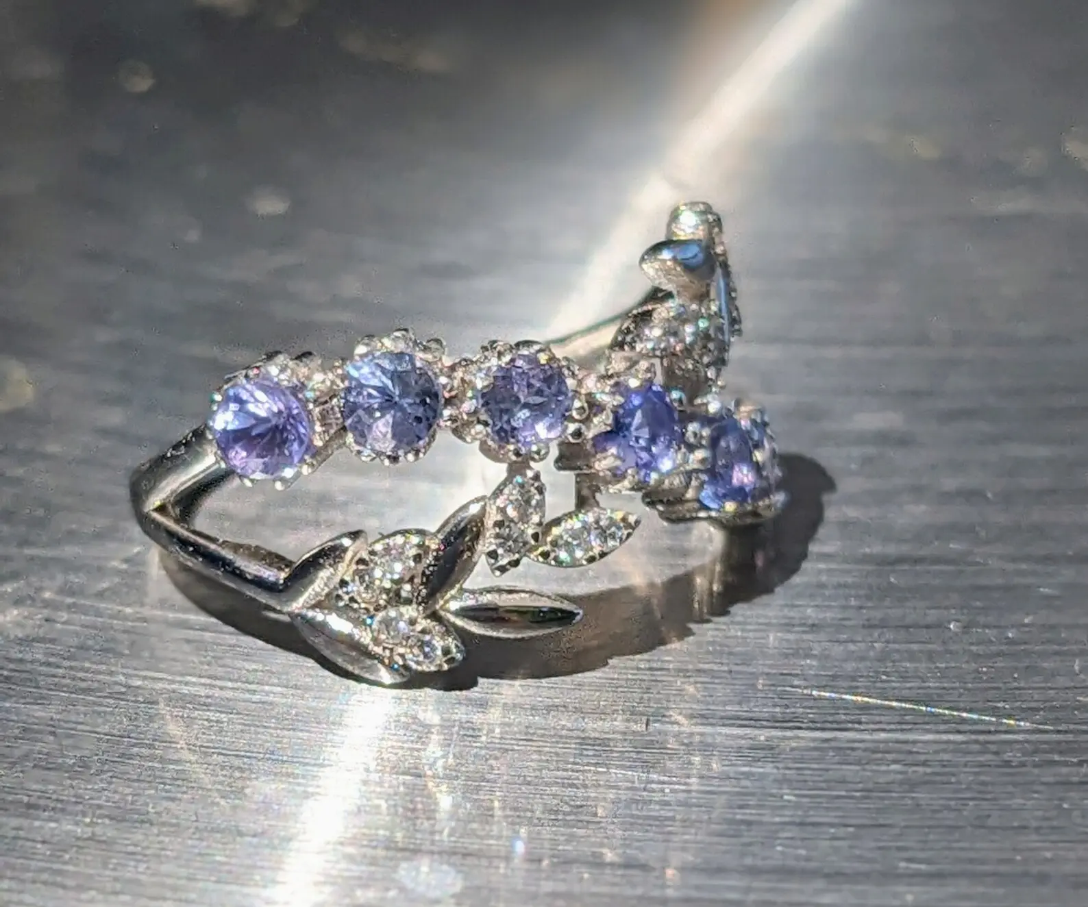 Tanzanite Ring: Sterling Silver Leaf Branch Band with Zircon Accents