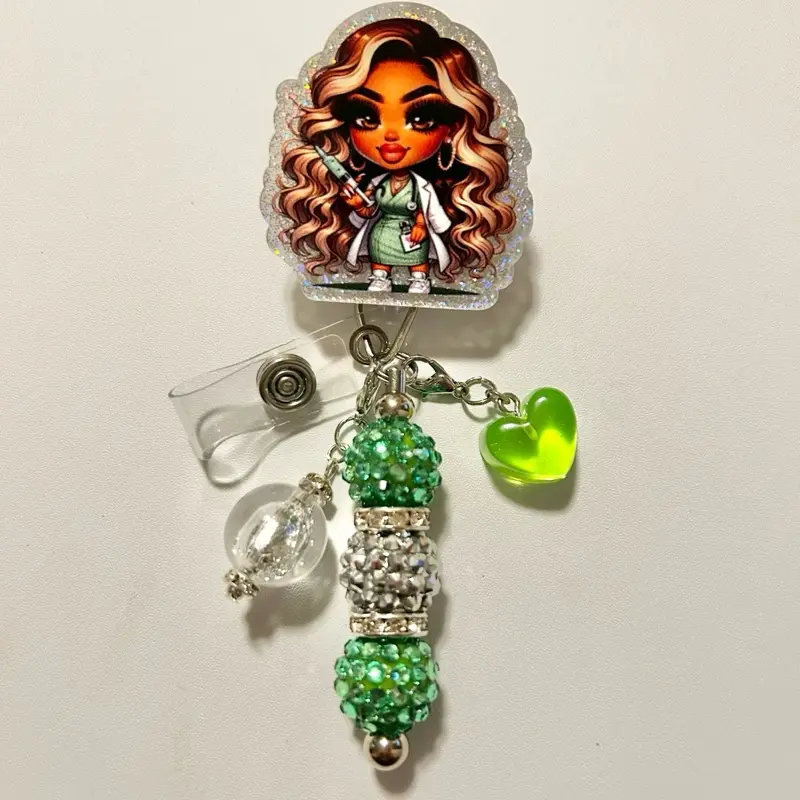 Charmed- Cute trendy retractable badge reel with alligator clip and colorful beads. Charms may vary from photo but will match colors in acrylic piece.