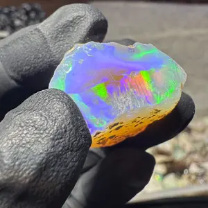 Elevate Your Collection with Exquisite Ethiopian Opal: Jewelry-Grade Rough featuring a Graceful White Canvas and Mesmerizing Neon Fire Dance