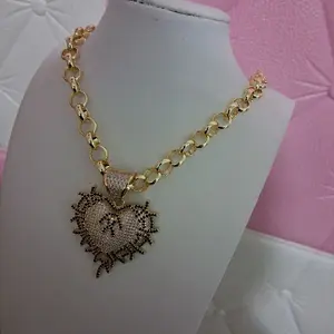 14 k gold laminated rolo chain with heart pendant.