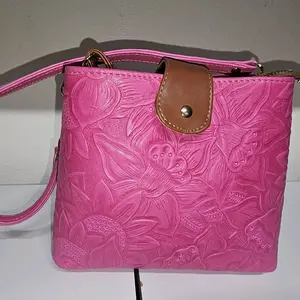 Elegant Pink Floral Embossed Leather Crossbody Bag with Brown Leather Accent and Secure Zip Closure for Everyday Use