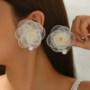 Unique women's earrings with a geometric, simple, and sophisticated design, featuring pearl and floral accents, versatile for vacation, casual wear, and parties