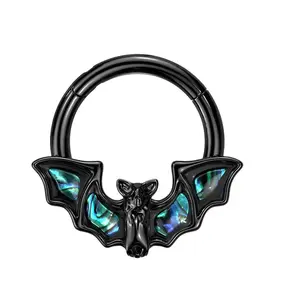 hinge segmented ring with abalone shell wings