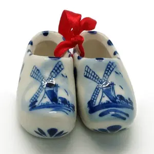 delft blue wooden clogs pair with windmill design