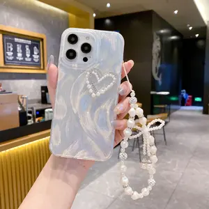 Elegant yarn lace iPhone case, suitable for 17 Pro and 14, with heart-shaped and pearl chain design, simple protective cover for spring and summer