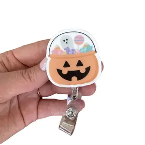 Pumpkin Treat Bag Badge Reel - Halloween Jack-O-Lantern Design with Colorful Treats - Retractable ID Badge Holder for Nurses Teachers & Office Staff - UV Printed Acrylic 1.8 x 1.9 Inches