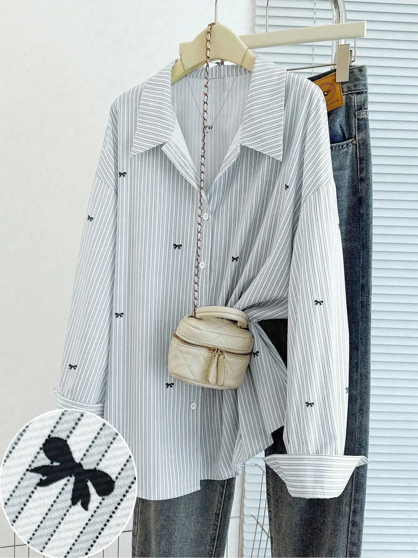 White fine-striped long-sleeve shirt with black bow detail.Blends French sweetness, Elegance and Korean casual style.Perfect for daily outings, commuting, dates, afternoon tea and vacations. Blouse