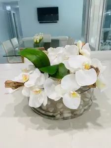 BOWL WITH WHITE ORCHIDS AND WOOD