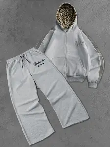 Men's autumn American-style fashion set, including a vintage-style hooded sweatshirt and drawstring waist sweatpants, featuring graphic letter and star patterns.  The set has a casual, loose fit, and the pants have an elastic waistband and pockets.