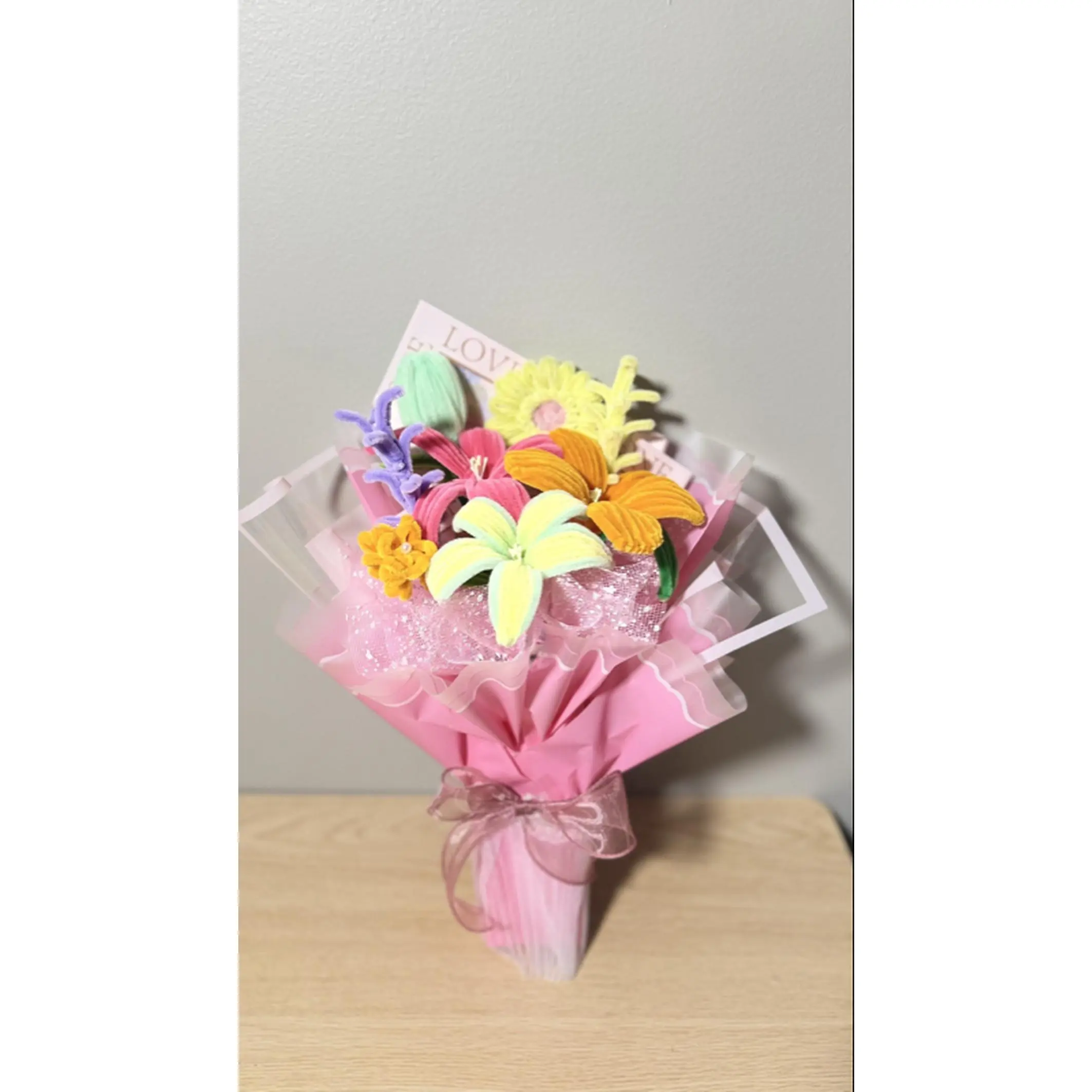 Colorful Flower Bouquet in Pink Wrap with "Love" Card Perfect for Gifting and Decor