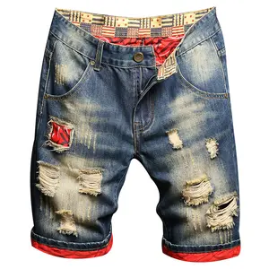 Retro distressed denim shorts with patchwork lining and rolled hem, streetwear