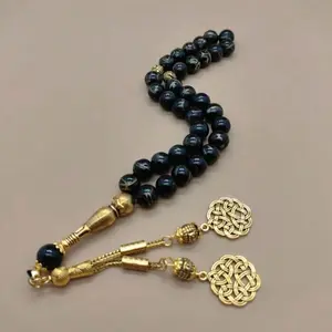 Tasbih-A string of prayer beads used for dhikr and meditation. Ideal for religious use, mindfulness, gifts, and personalized accessories. Standard (33beads), custom with initials. Gemstones, customizable with name initial. Durable and elegant.
