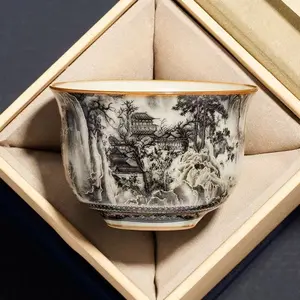 Master handcrafted Ruyao tea cup featuring ink landscape design, round ding form, gift box packaging