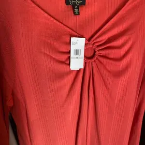 Coral colored blouse