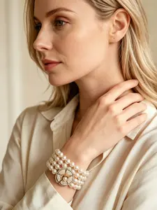A vintage and elegant multi-layered pearl bracelet, adorned with central camellia and diamond accents that complement the pearls, perfect for daily commuting, vacation, and dating. It is also a delightful and exquisite small gift