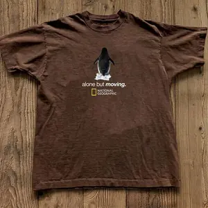 Gildan Men's and Women's T-shirt, Penguin “alone but moving” Graphic Tee, Penguin, Wildlife, Animal Tee, Unisex T-shirt, Gift T-shirt, Y2k Unisex Graphic Tees Gothic Grunge Emo Scene Amity Affliction Style Clothes Menswear Womenswear Streetwear