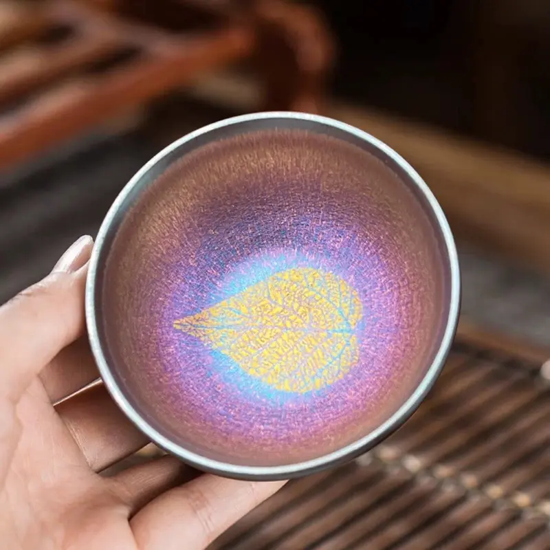 Iridescent Gold-Leaf Jianzhan Teacup — Traditional Chinese Handcrafted Teaware. Leaf Pattern Within, Iridescent Rainbow Halo, Artisan Craft, Collectible Piece, Fired at 1300°C, Food-Safe Ceramic, Elegant Gift, Gift Box Included